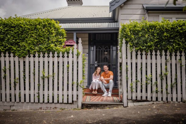 First home buyers on the front step of their new home